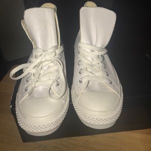 White leather Chuck Taylors high tops