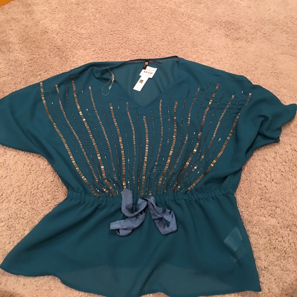 Teal top with gold design