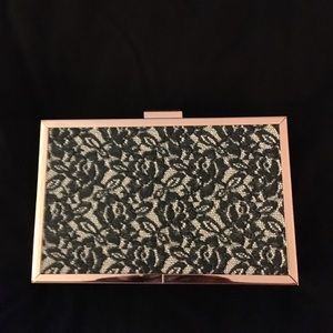 Faux lace clasp clutch