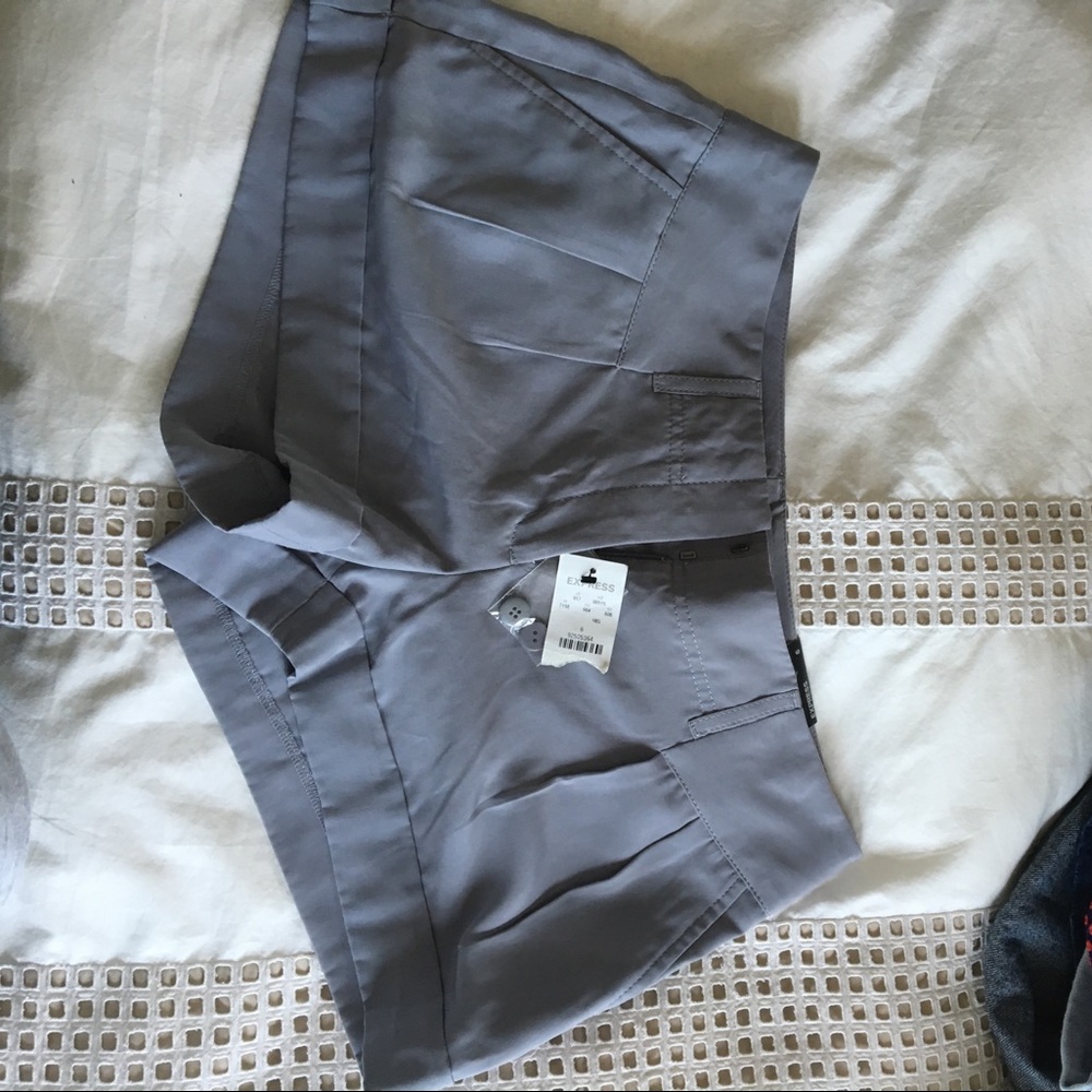 Tags still on express shorts