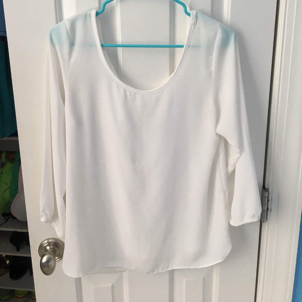 White blouse with bow in back