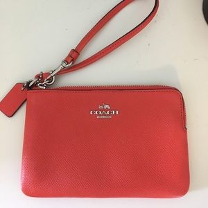 Wristlet Coach. NEVER USED. Has tags inside