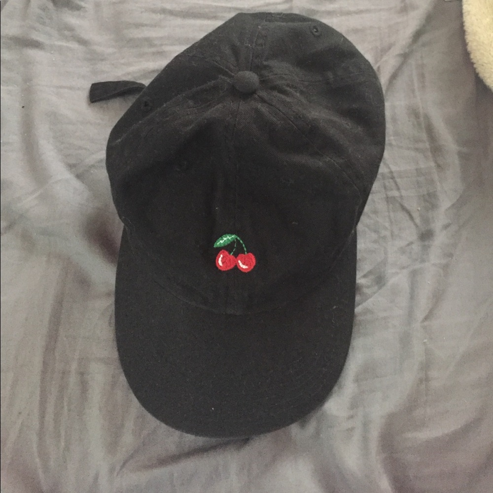 Black cap with cherry
