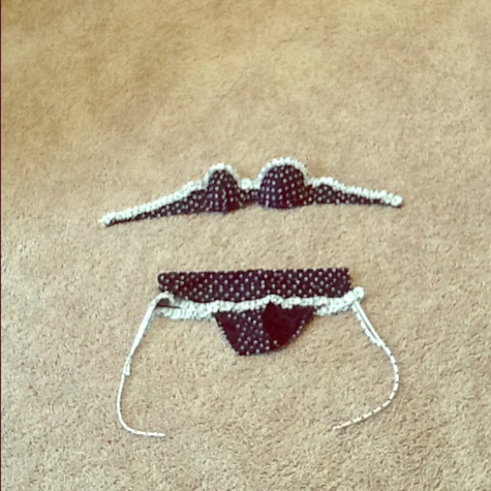 Polka dotted bikini with ruffle edge.