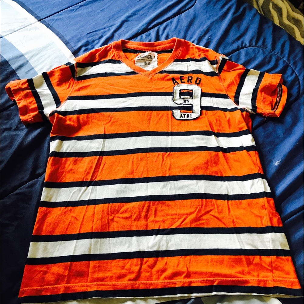 Orange and white striped Aeropostale shirt.
