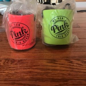 A pink Victoria's Secret can holder with strap