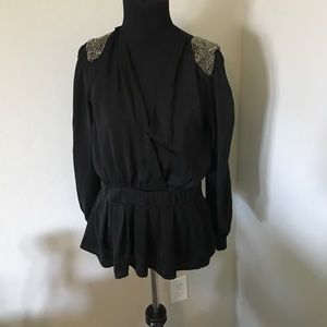 Boutique peplum top with silver beaded shoulders