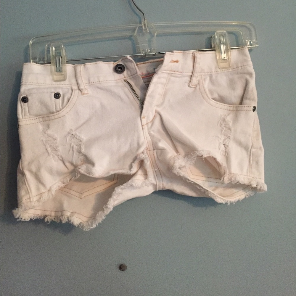 Trendy ripped white jean shorts