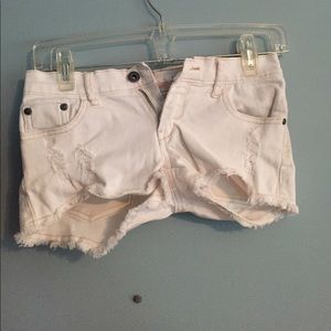 Trendy ripped white jean shorts