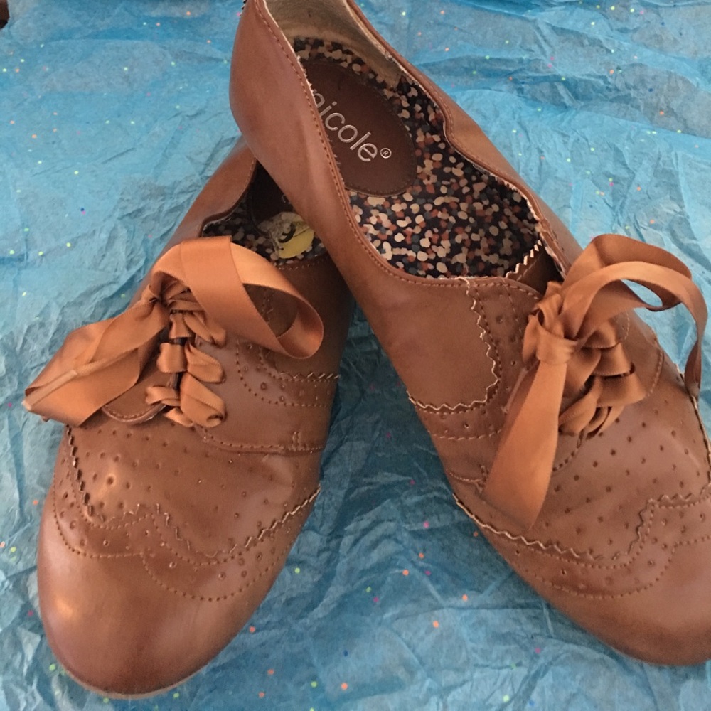 Brown flat shoe.  Cognac