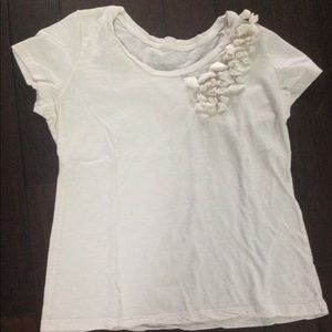 Cream colored tee with flower detail
