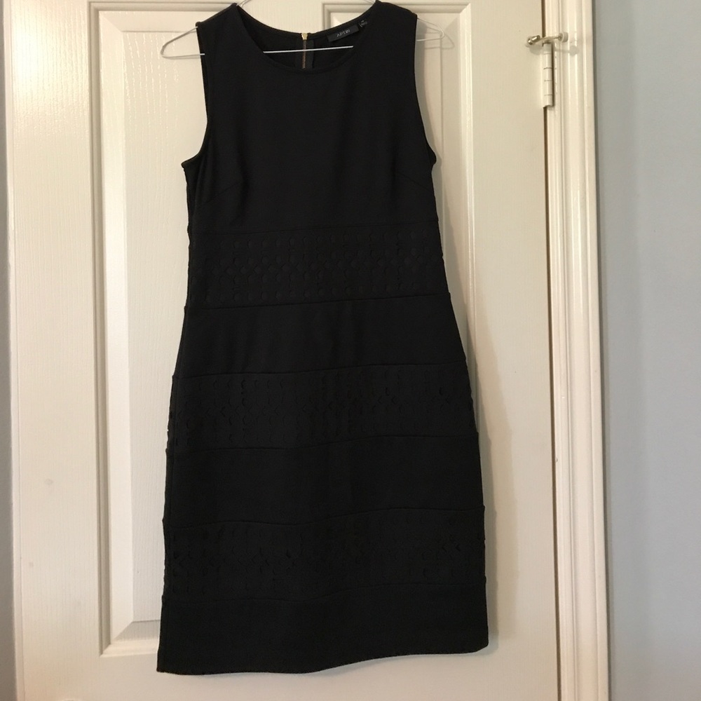 Black dress with cutout stripes and gold back zip