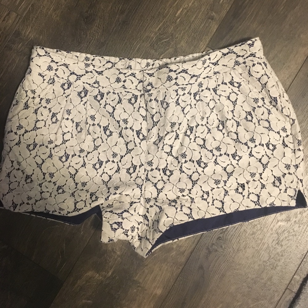 White flowery overlay shorts