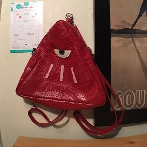 Red triangle illuminati backpack