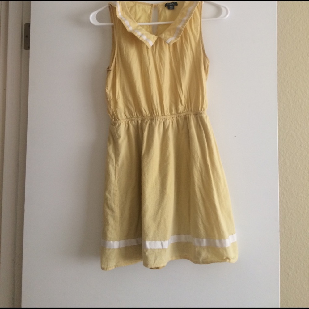Yellow sundress with white trim