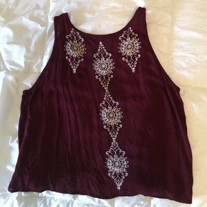 Embroidered open back tank top.