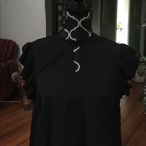 Black silky sleeveless top.