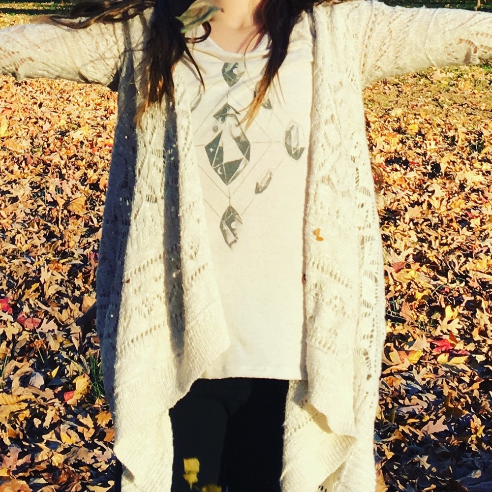 A justice sweater and It is cream colored