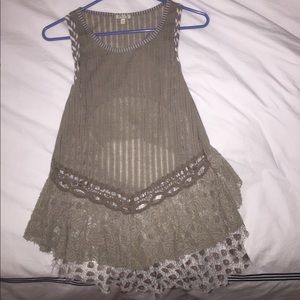 Tank top with lace trim and opening in back