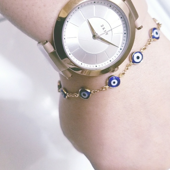 DKNY gold tone with caramel/tan color strap