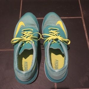 Turquoise Nike running shoes