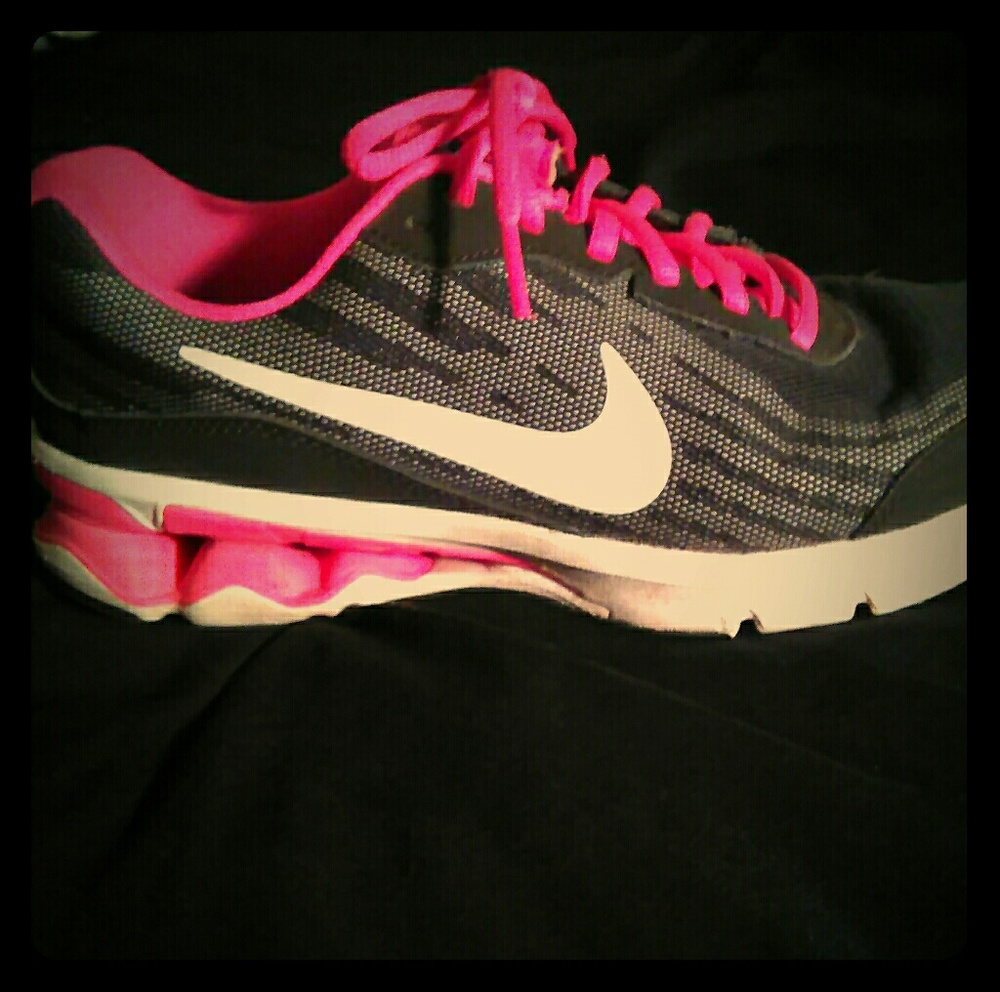 Black and pink Nikes gently used