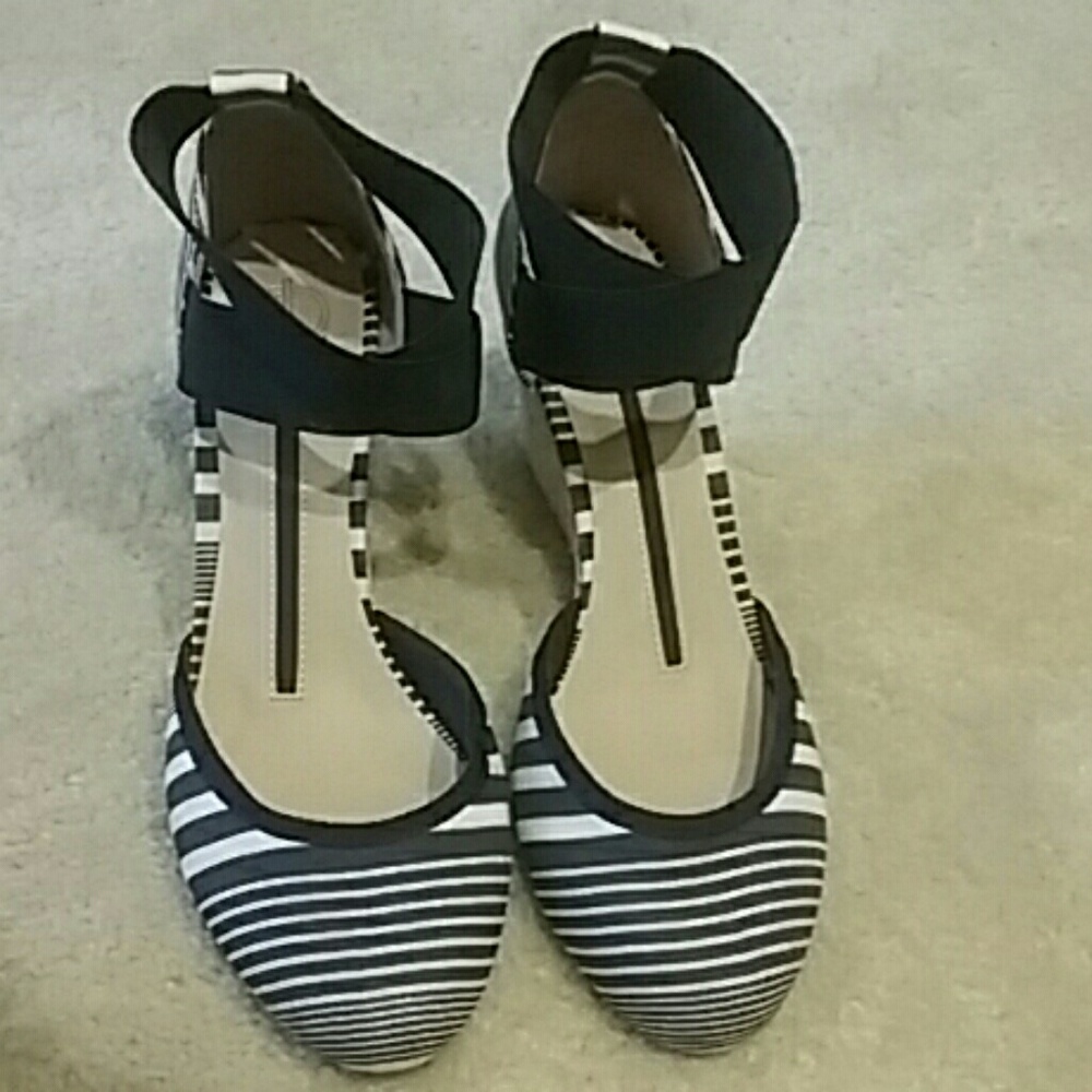 Gently worn blue, white, and tan wedges