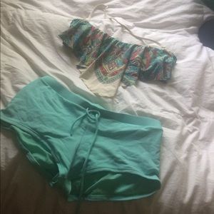 Swimsuit bikini top with boy shirt bottoms