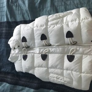 White sleeveless water proof jacket.