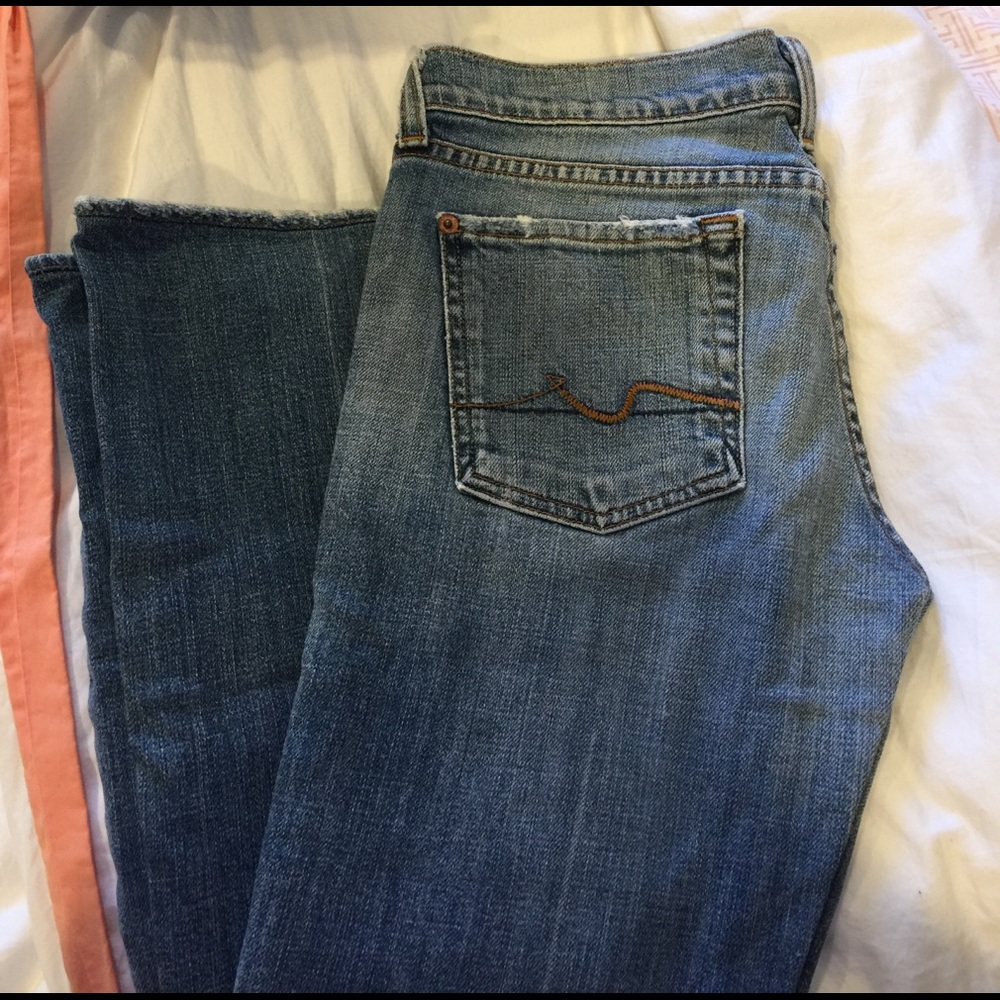 7 for All Mankind medium wash denim jeans!