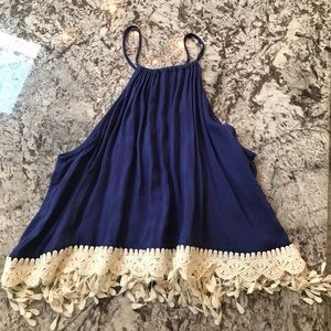 Blue shirt with white lace/fringe bottom