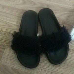 Black furry slides .