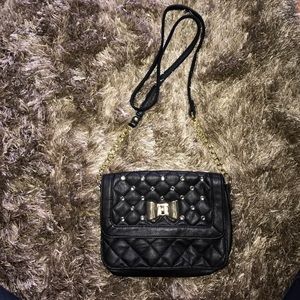 Mini black purse with a golden bow