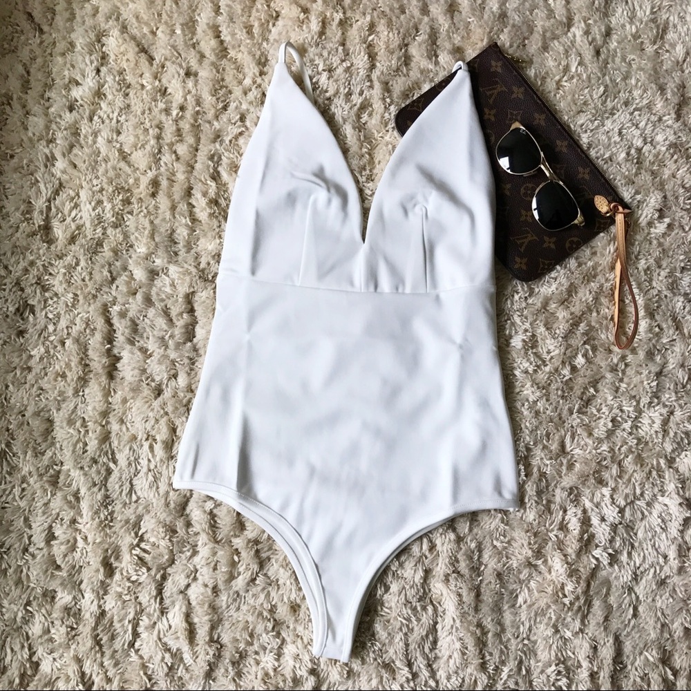 NWT deep V white bodysuit.