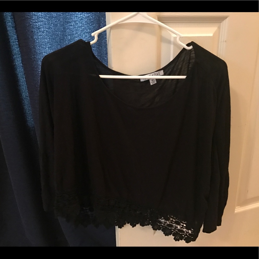 A black 3 quarter length women's shirt