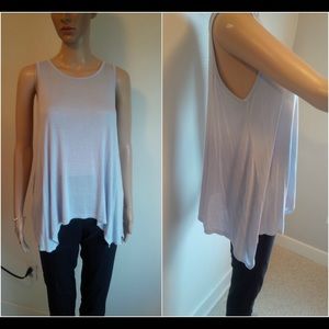 Two beautiful loose, sleeveless shirts