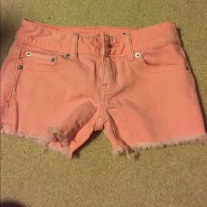 Salmon colored jean shorts