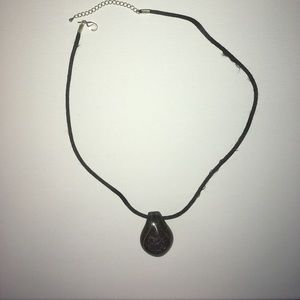 Glass pendant on silk cord