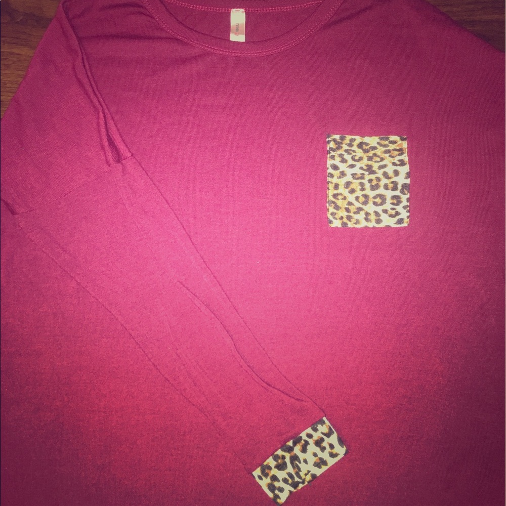 Long sleeved maroon cheetah print t-shirt.