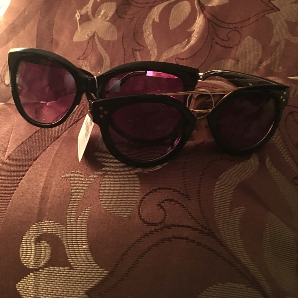 Two pair of new sun glasses