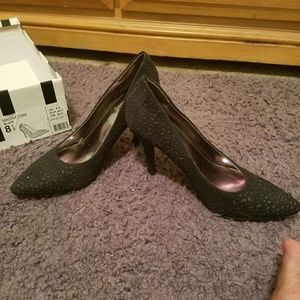 Black pointed toe pumps