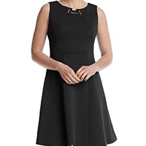 sleeveless with gold toggle chain at the neckline