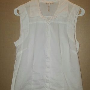 Button up sleeveless white blouse.