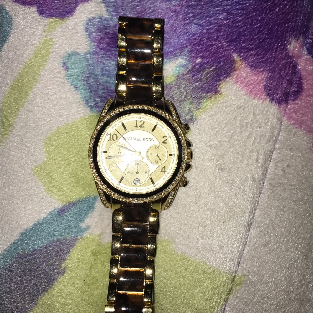 Gold and black Michael Kors watch