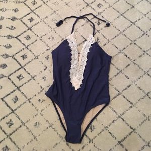 Lace and navy one piece halter swimsuit