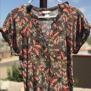 Modern, multi-patterned blouse