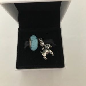 Two Pandora charms, ram and blue