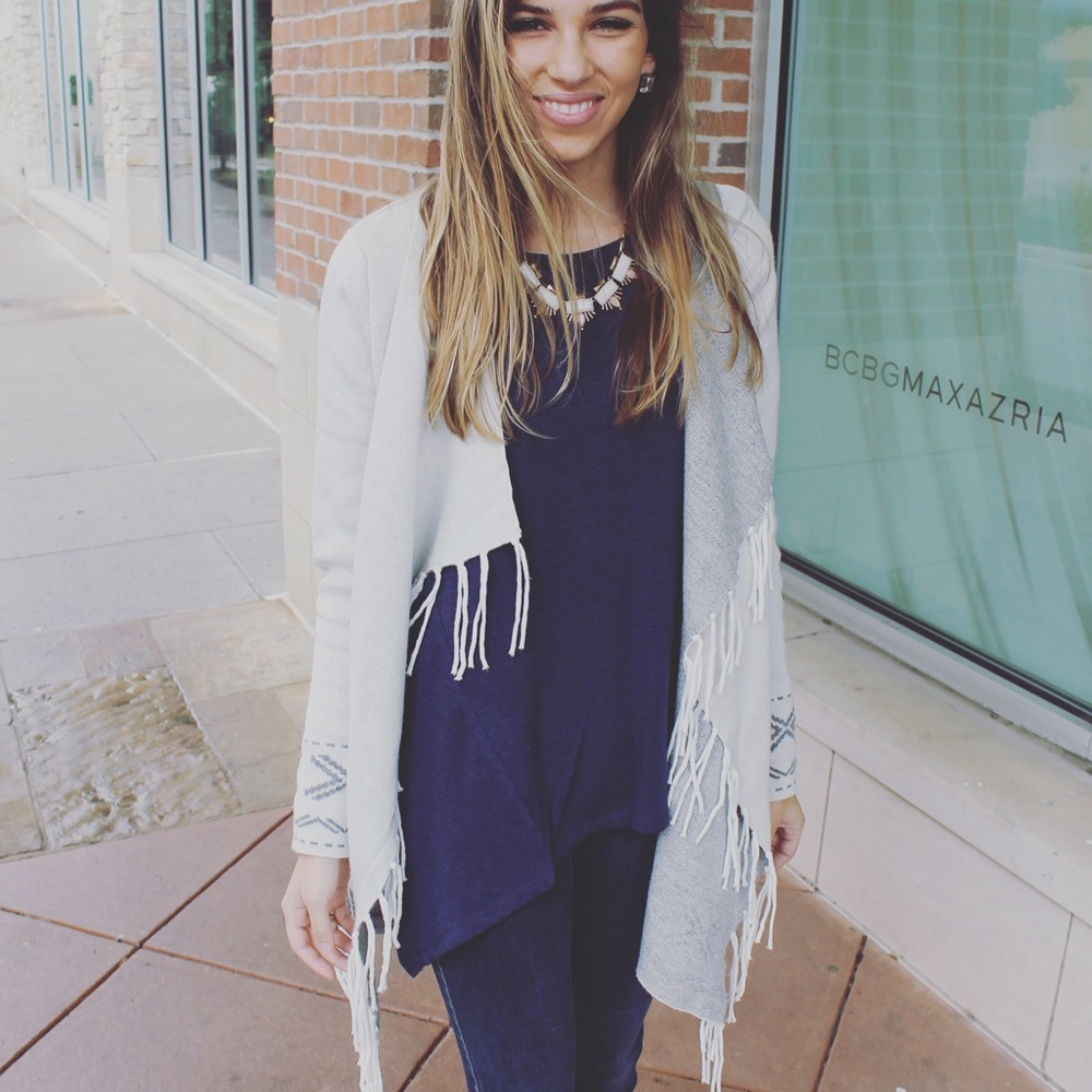 BRAND NEW. Long sleeve navy blouse.