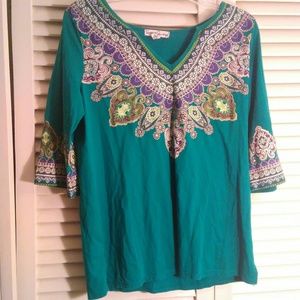 Teal color top with beautiful design.