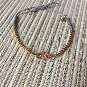Bracelet with rose gold (plated) wing